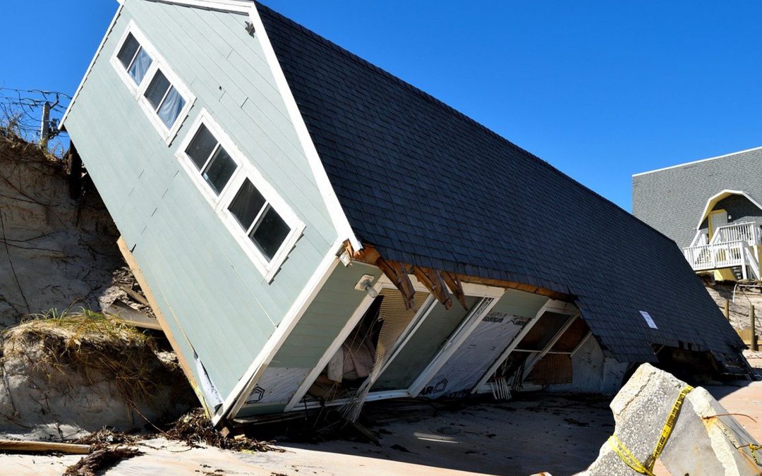 a house that fell off a cliff due to an hurricane