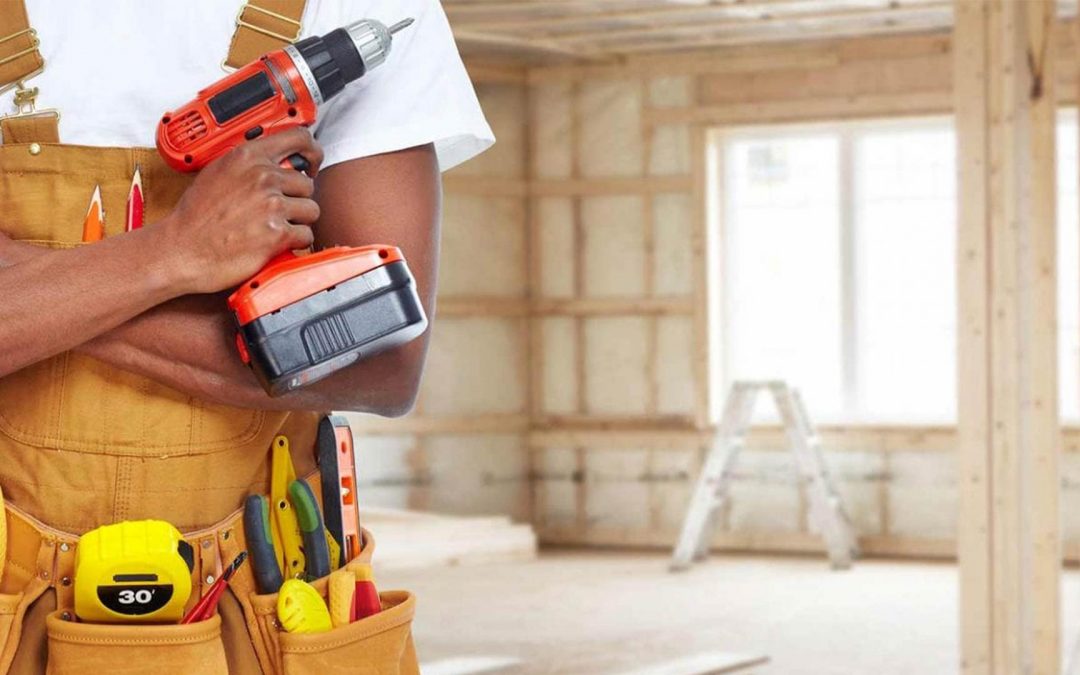 construction worker holding a drill